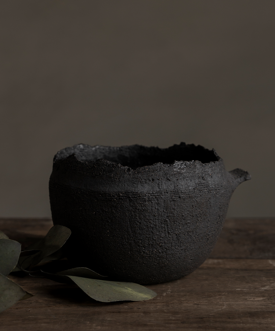Black Vessel With Handle